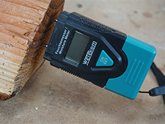 User moisture meter on wood for our log stores